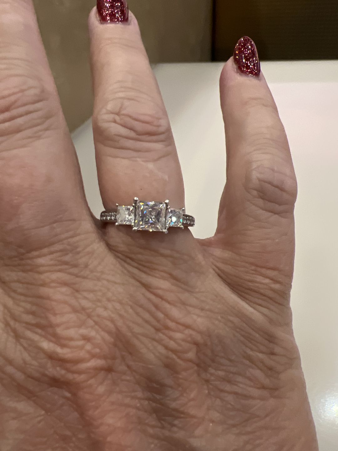 Customer photo review of Three Stone Princess Cut Moissanite Pavé Set Engagement Ring