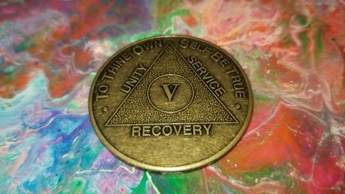 Customer photo review of Recovery Mint 5 Year Bronze AA Meeting Chips - Five Year Sobriety Coins/Tokens