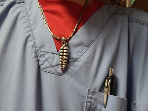 Customer photo review of Brass Rattlesnake Tail Pendant