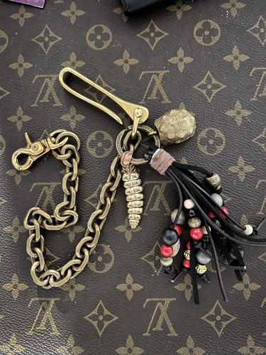 Customer photo review of Brass Tortoise Bell Pendant