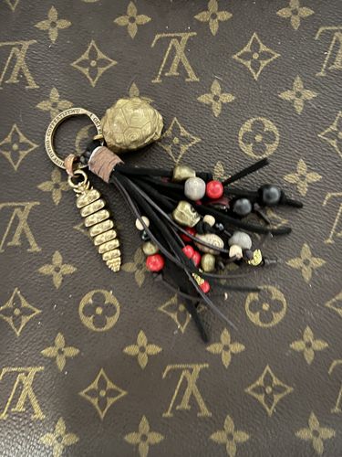 Customer photo review of Brass Rattlesnake Tail Pendant