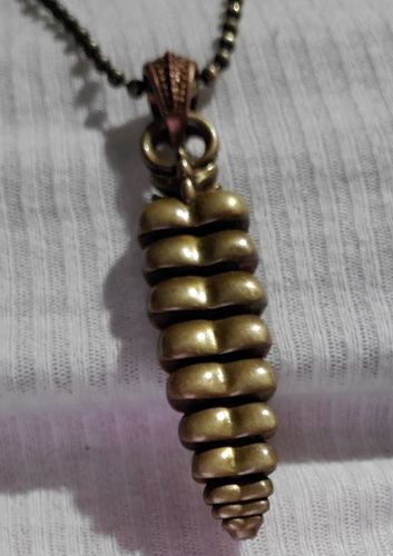 Customer photo review of Brass Rattlesnake Tail Pendant