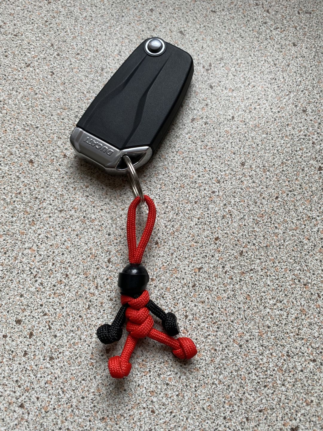 Customer photo review of Black Red Biker Buddy Paracord Keychain