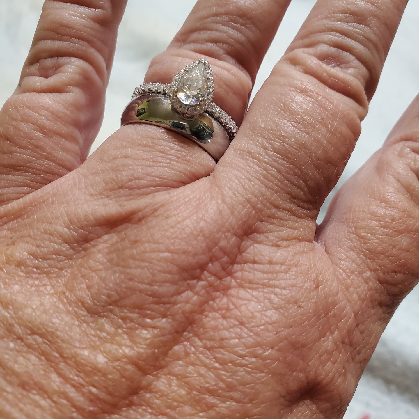 Customer photo review of Halo Pear Moissanite Triple Row Pave Engagement Ring