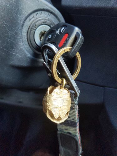 Customer photo review of Brass Tortoise Bell Pendant