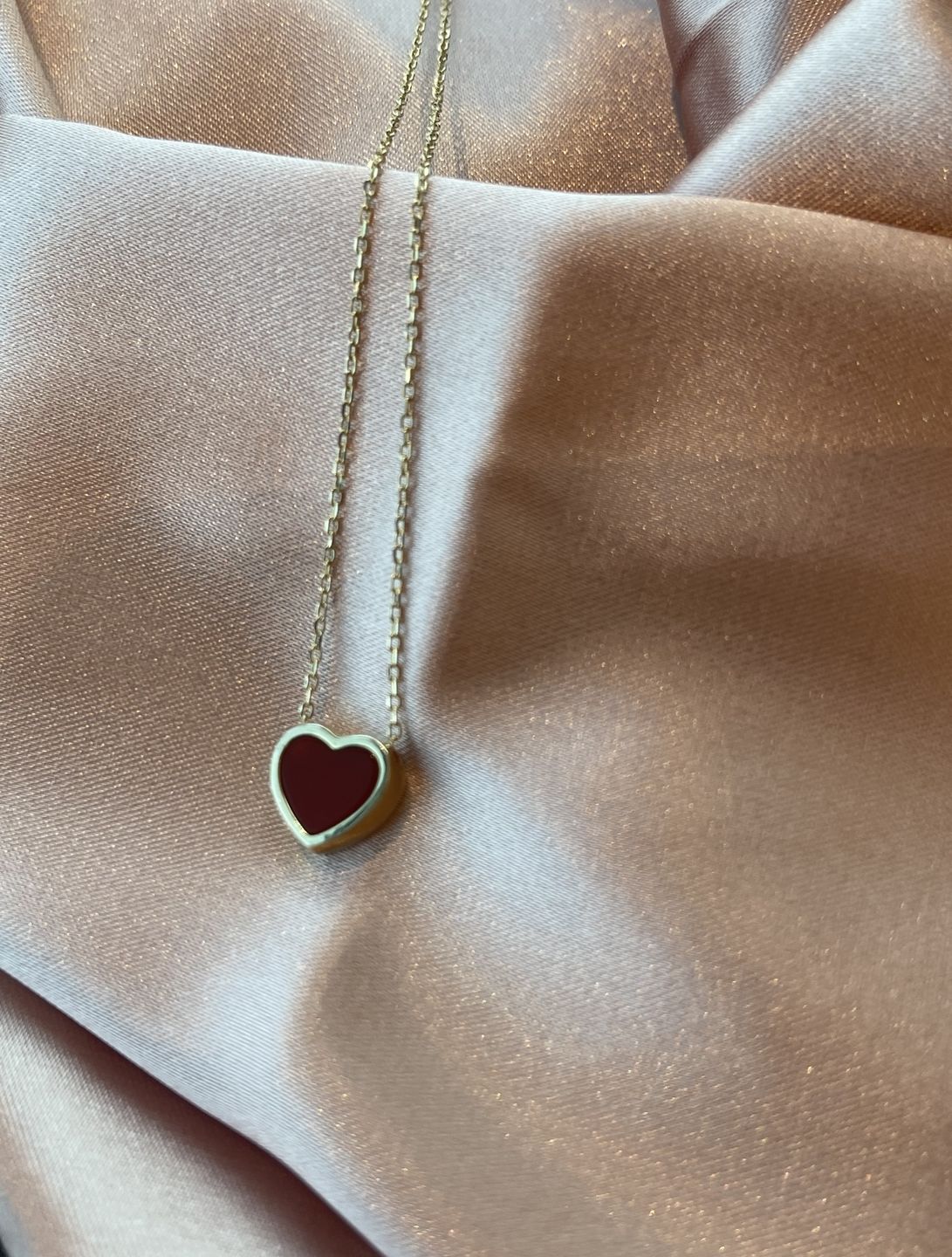 Customer photo review of Tiny Heart Necklace