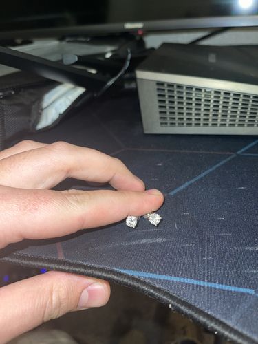 Customer photo review of VVS Moissanite Solitaire Stud Earrings