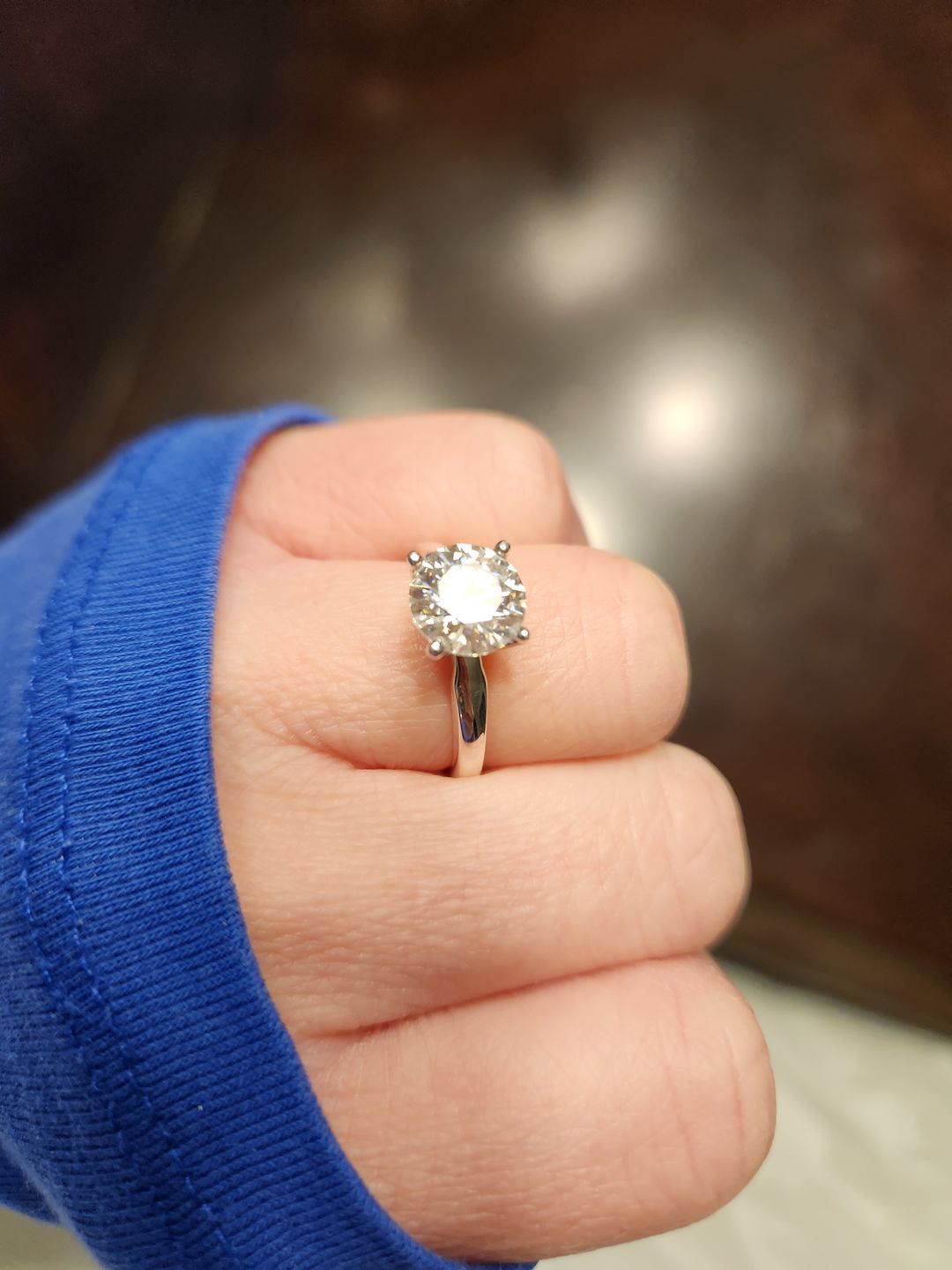 Customer photo review of Classic Solitaire Round Moissanite Four Prong Engagement Ring