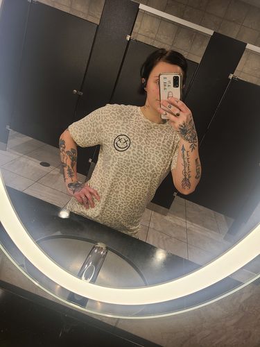 Customer photo review of Salty Savage Unisex “OG Smile” Tee | Basic | Natural Leopard/Black