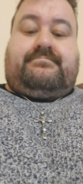 Customer photo review of Jesus Piece. Necklace