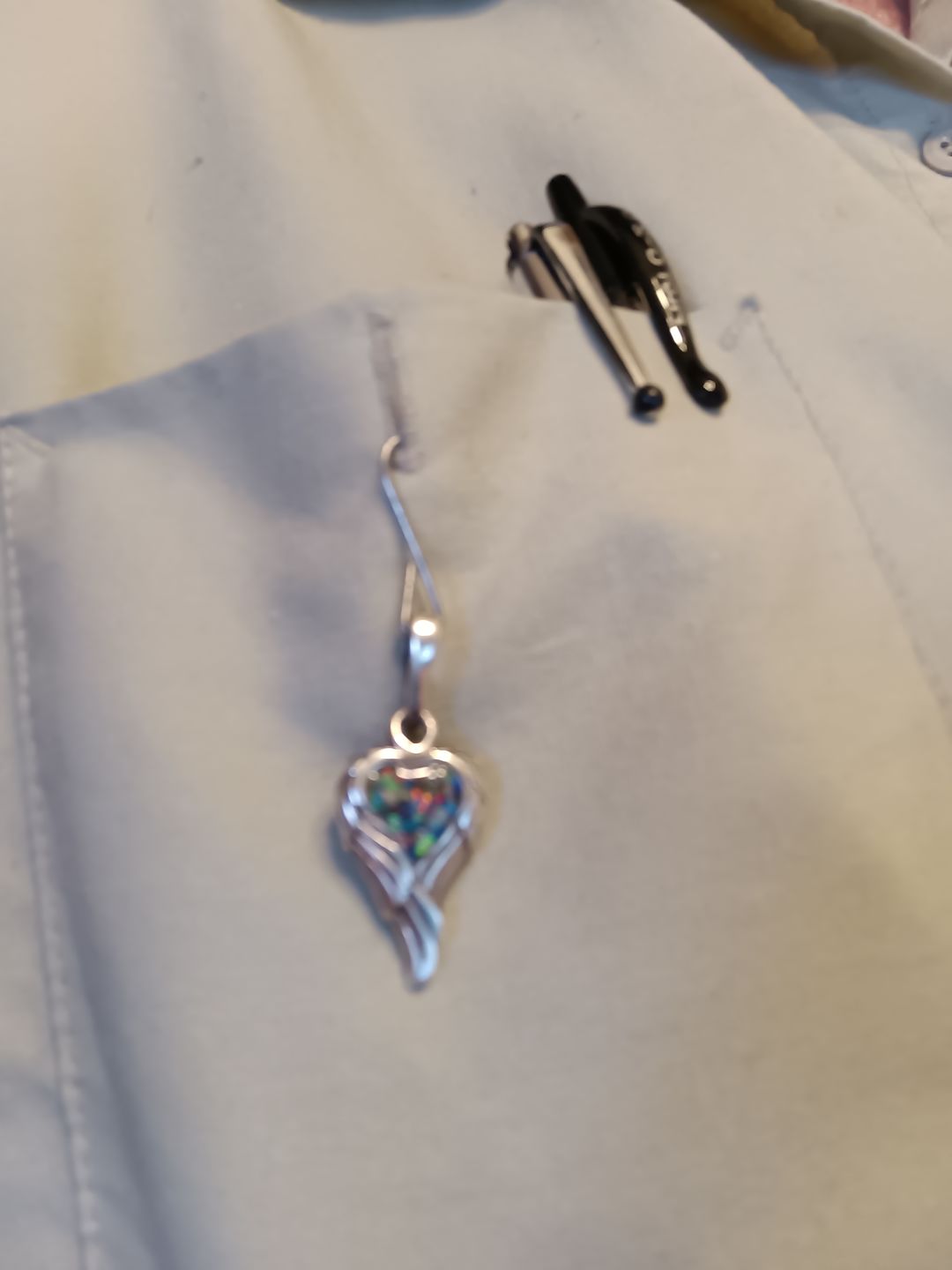 Customer photo review of Petite Angel Wing Pendant - Engravable