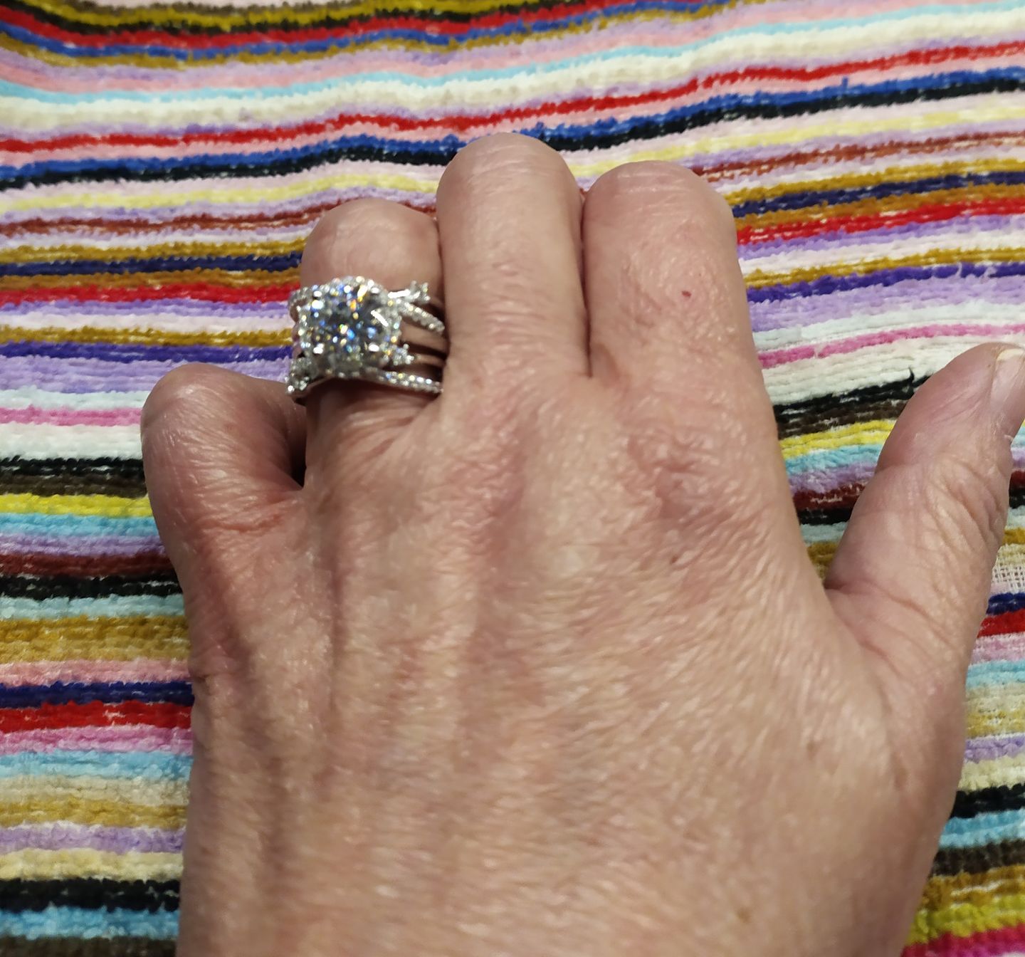Customer photo review of Halo Moissanite With Enhancer Cross Shank Bridal Engagement Ring Set