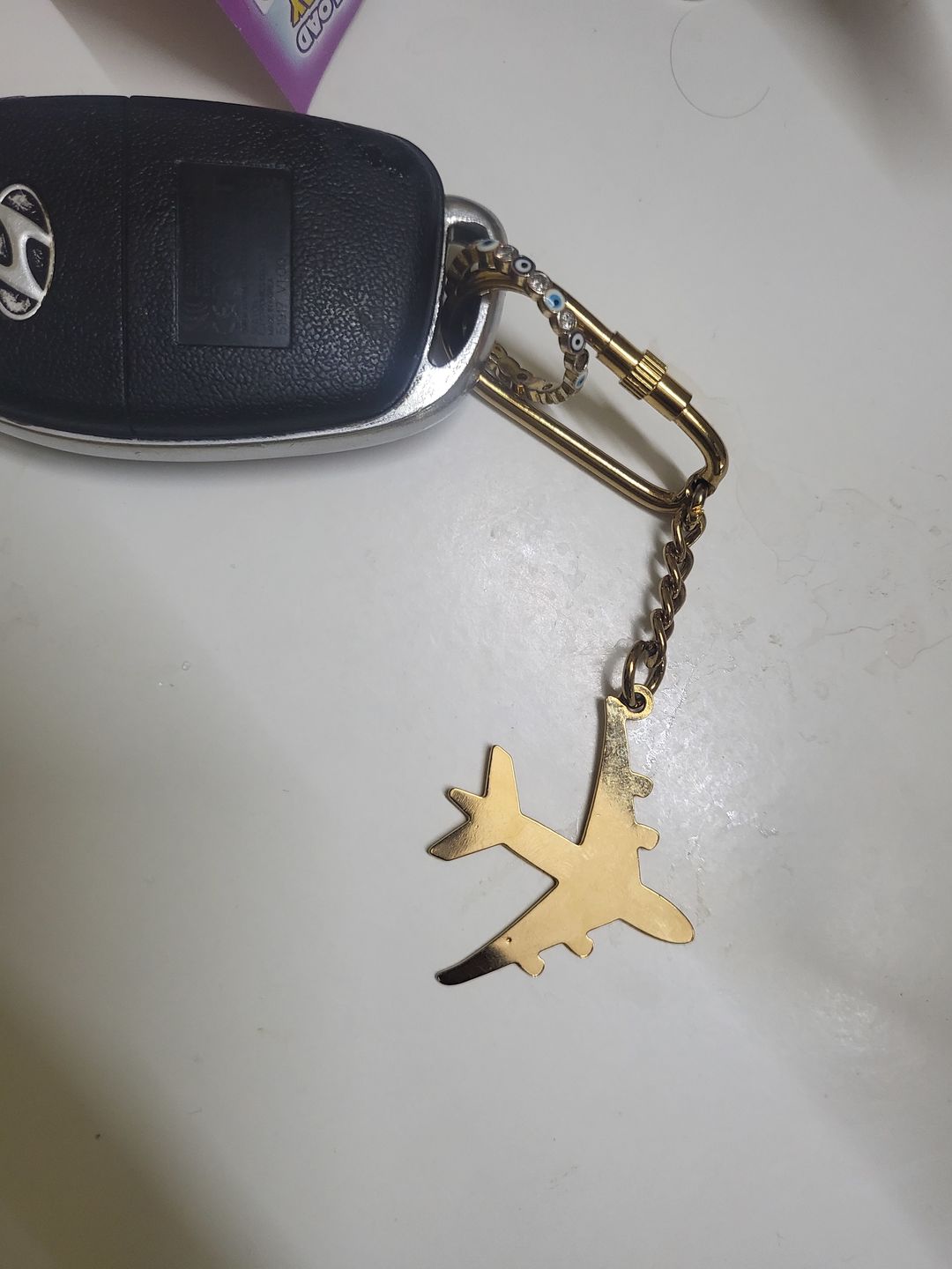 Customer photo review of Keychain Aeroplane - Goldplated