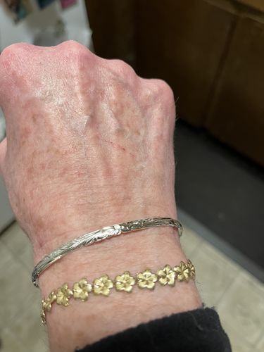 Customer photo review of Sterling Silver Hawaiian Scroll Cut Out Edge Bangle