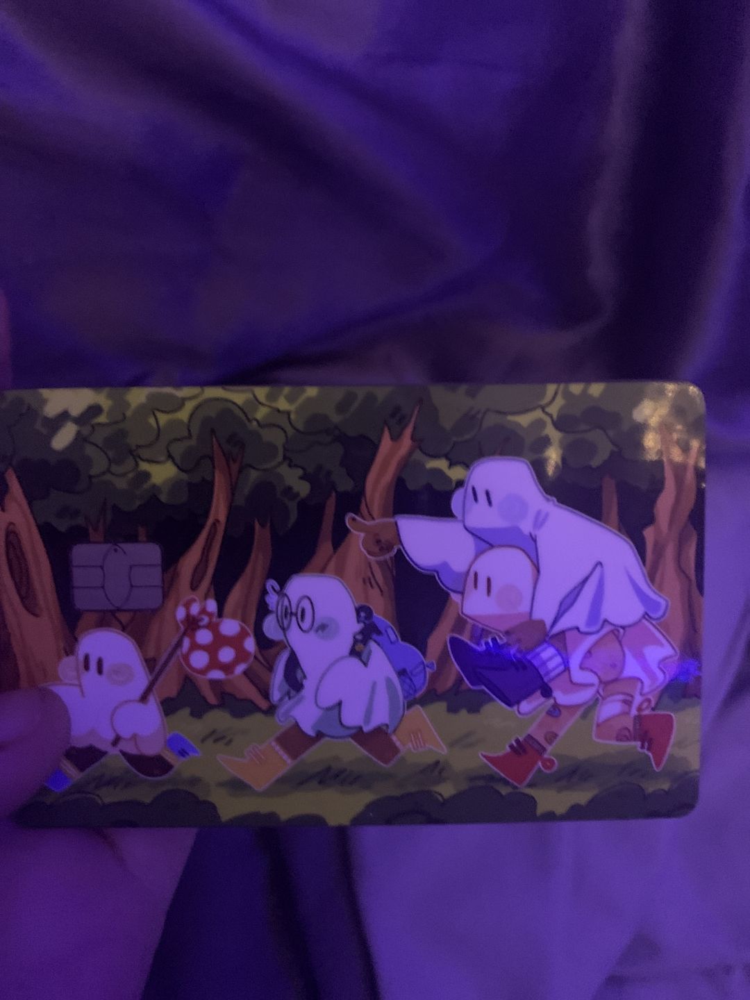 Customer photo review of Runaway Ghosts Credit Card Skins