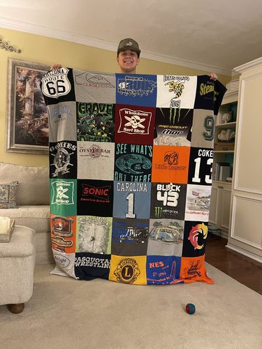 T-shirt quilt with wrestling, southern cuisine themes by Amy from NC