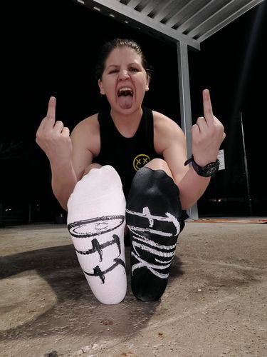 Customer photo review of Salty Savage Unisex “FUCK OFF” Mix Matched Crew Socks | Black/White