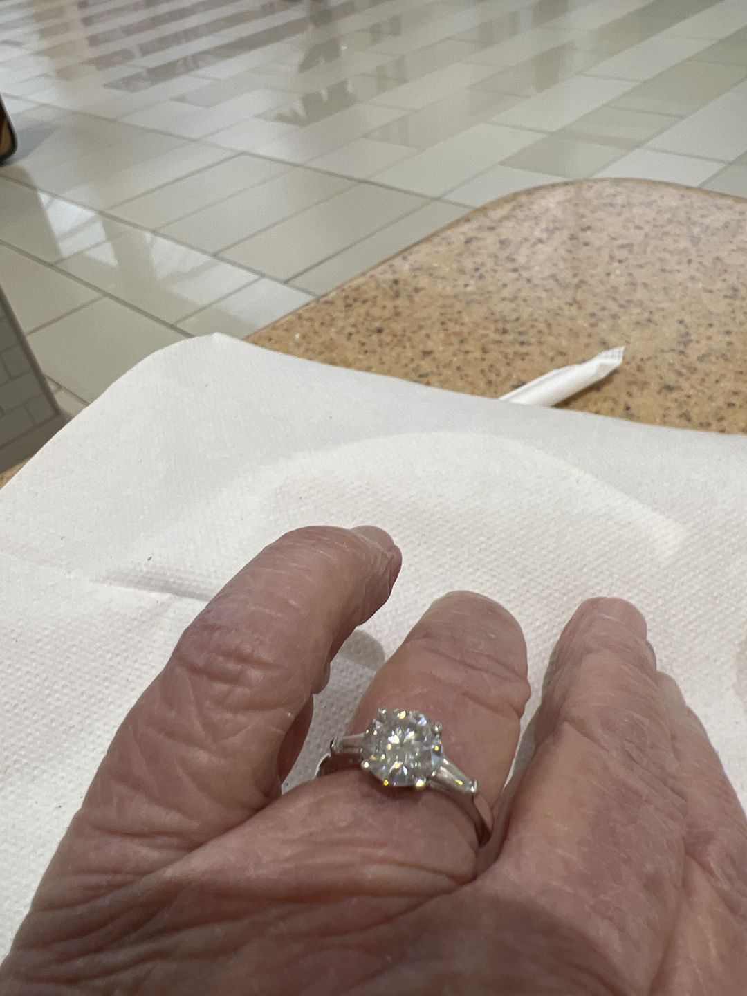 Customer photo review of Three Stone Round Moissanite Tapered Baguette Engagement Ring