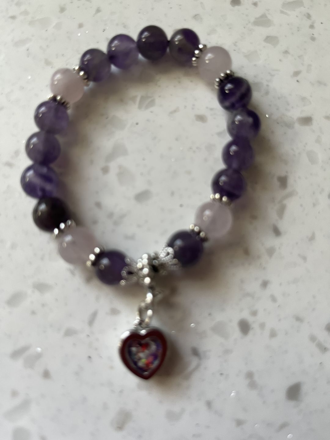 Customer photo review of Amethyst and Rose Quartz Healing Bracelet with Cremation Ashes