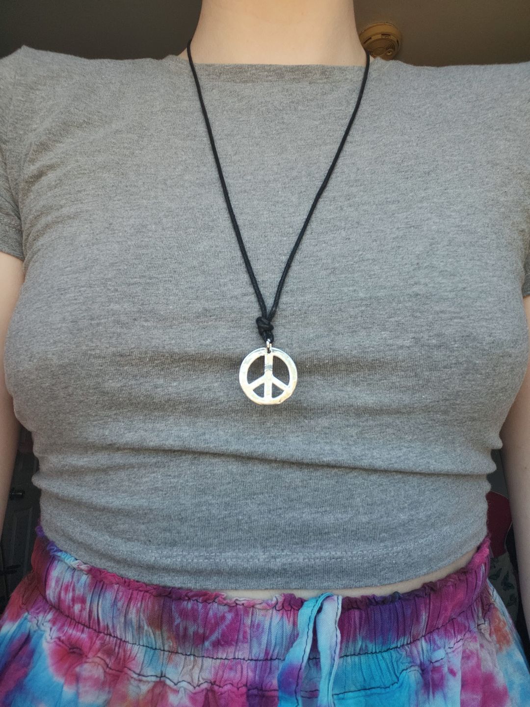 Customer photo review of Chrome Peace Necklace
