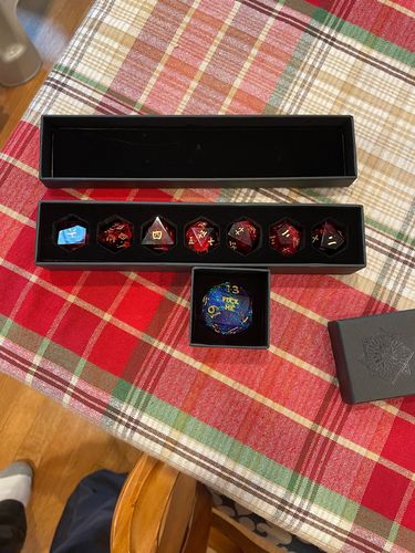 Customer photo review of Sharp Edge Purple Glitter Resin DnD Dice Chonk D20 U-F*cker F*ck Me F*ck You Dice