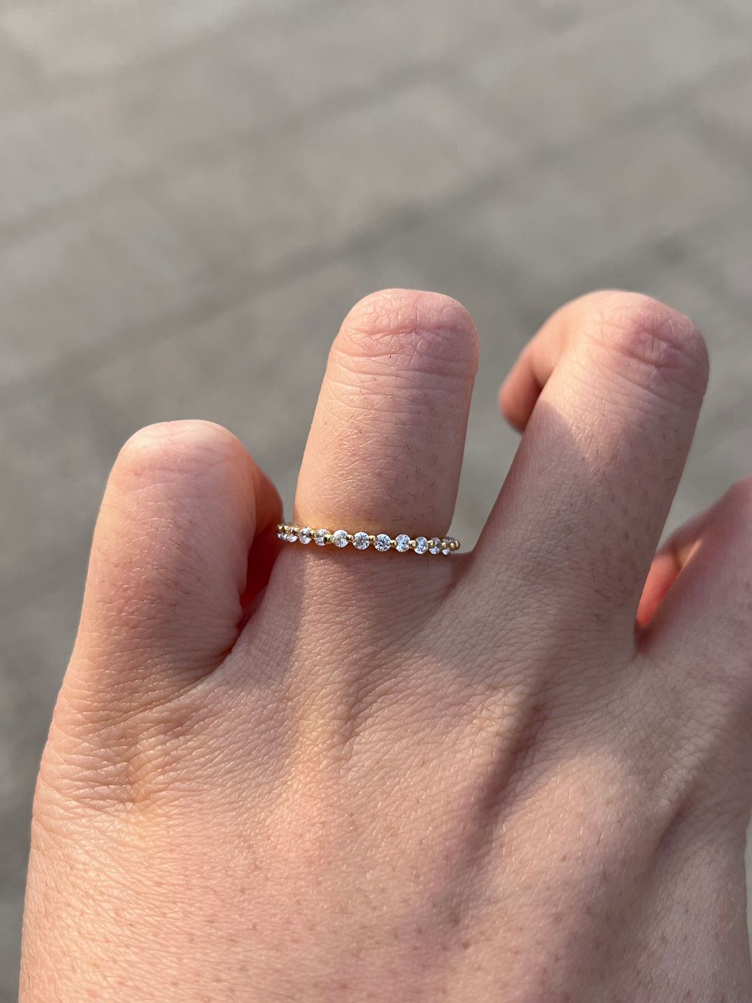Customer photo review of Louily Classic Round Cut Full Eternity Wedding Band In Sterling Silver