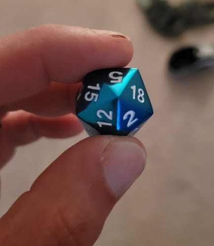 Customer photo review of H30 | Blue Metal DND Dice Set