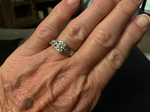 Customer photo review of Bezel Set Round Moissanite Scroll Accents Engagement Ring