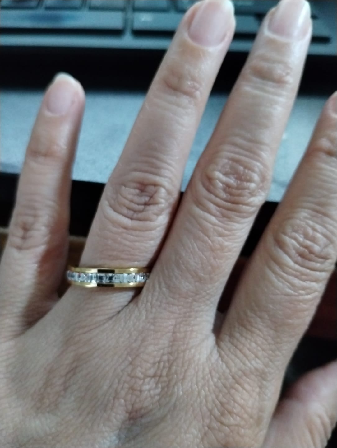 Customer photo review of 4MM 14k Gold Princess Cut Women's Eternity Titanium Ring Wedding Band with CZ