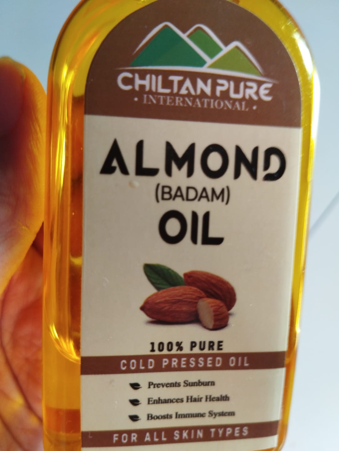 Customer photo review of Sweet Almond Oil – Treats Acne, Dark Spots & Damaged Scalp