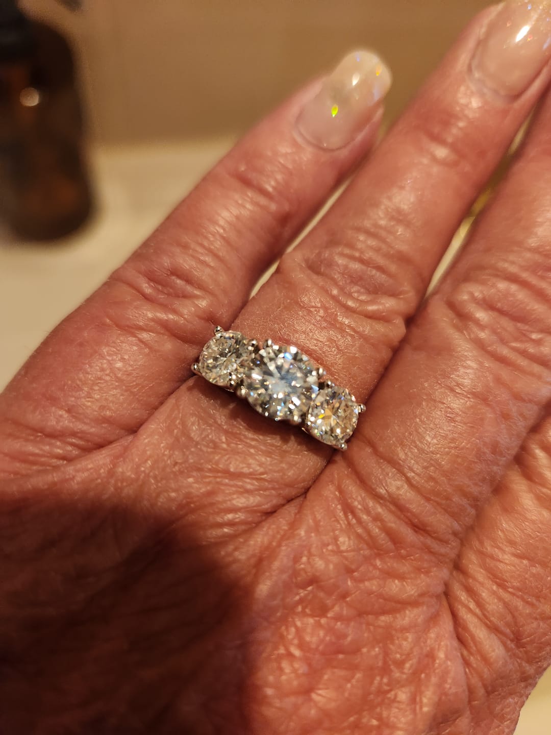 Customer photo review of Classic Three Stone Round Cut Moissanite Sterling Silver Wedding Ring