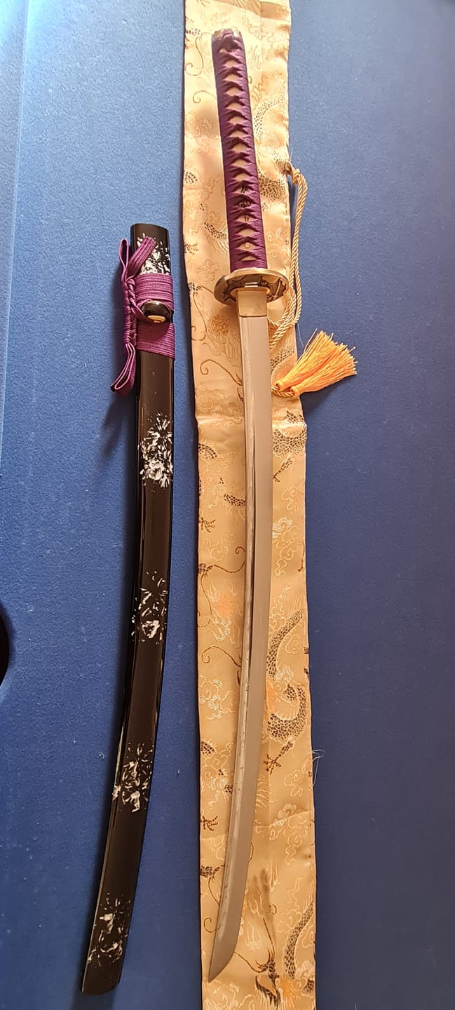 Customer photo review of Hand Forged 1060 High Carbon Steel Blade Full Tang Oil Quenched Samurai Katana Sword