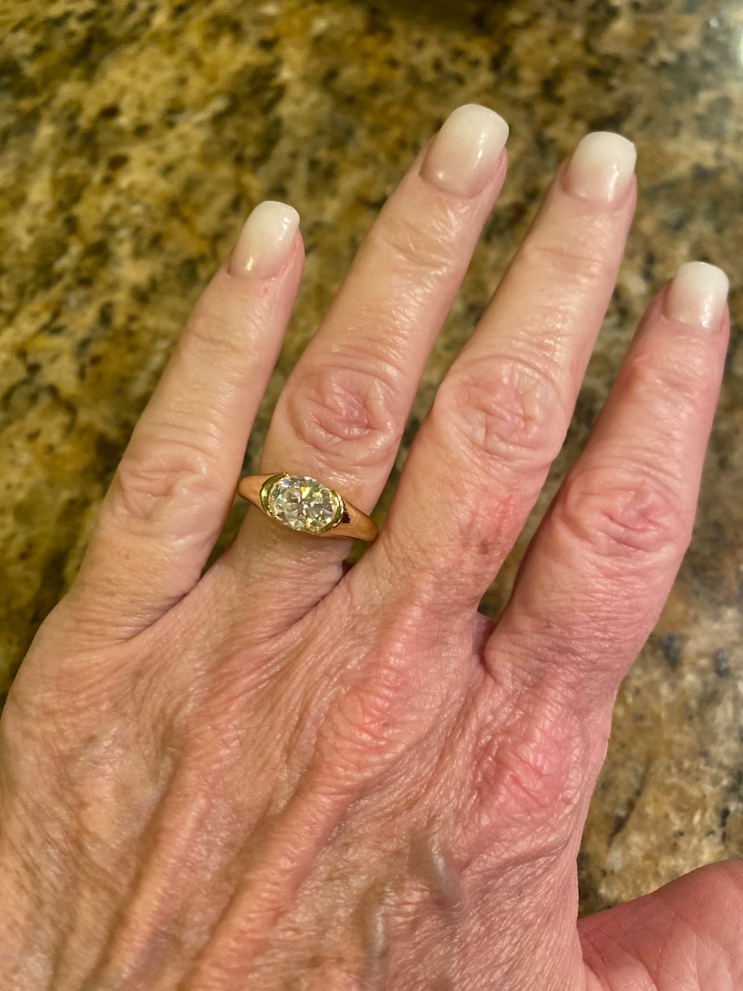 Customer photo review of Solitaire Oval Moissanite Half Bezel Set Engagement Ring