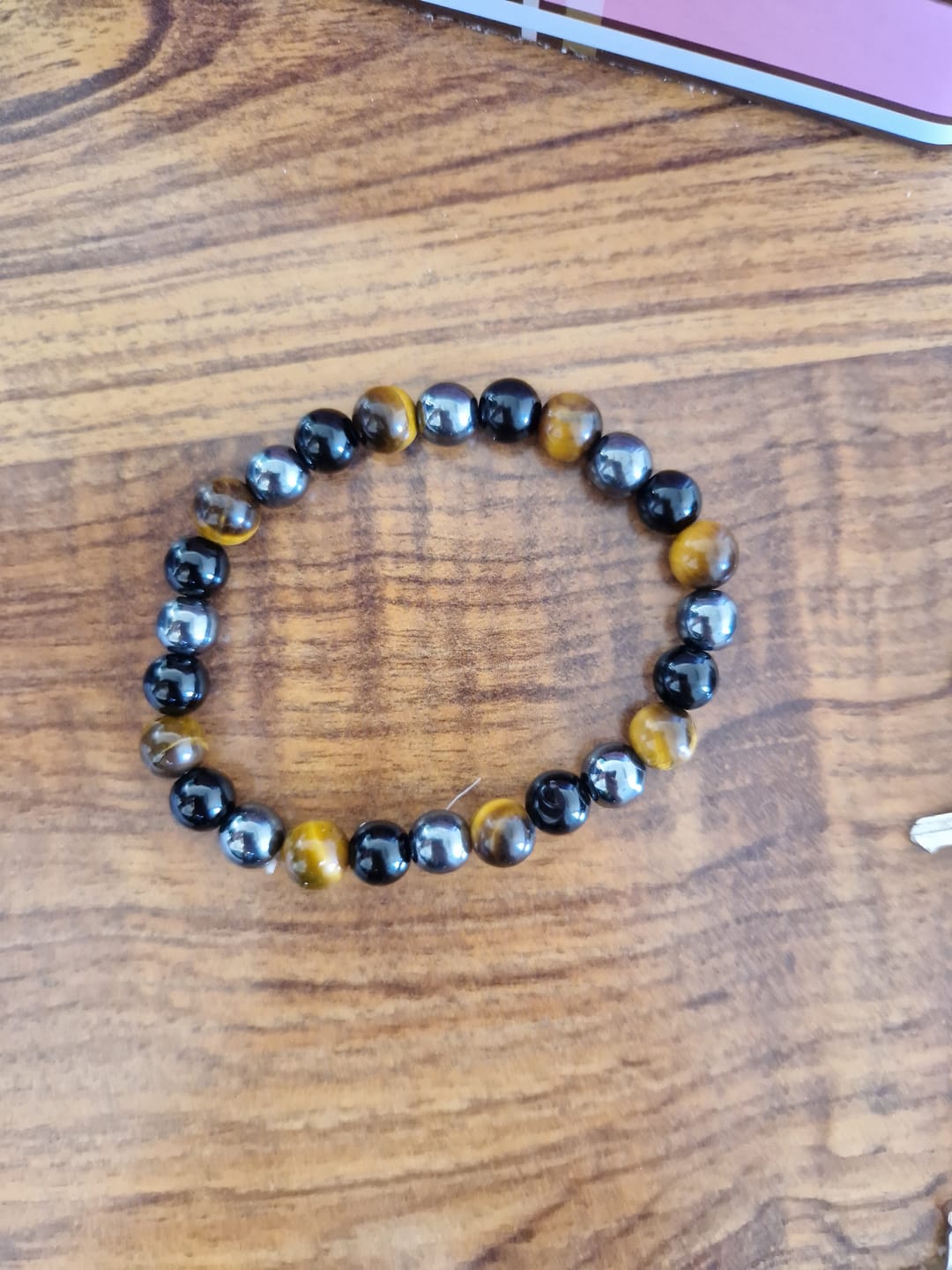 Customer photo review of Bracelet "3 Protections" en Oeil de Tigre, Hématite & Obsidienne Noire