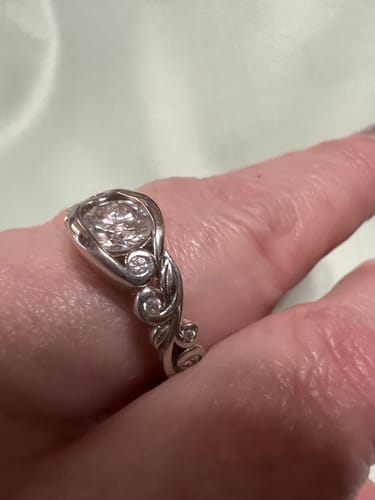Customer photo review of Bezel Set Round Moissanite Scroll Accents Engagement Ring