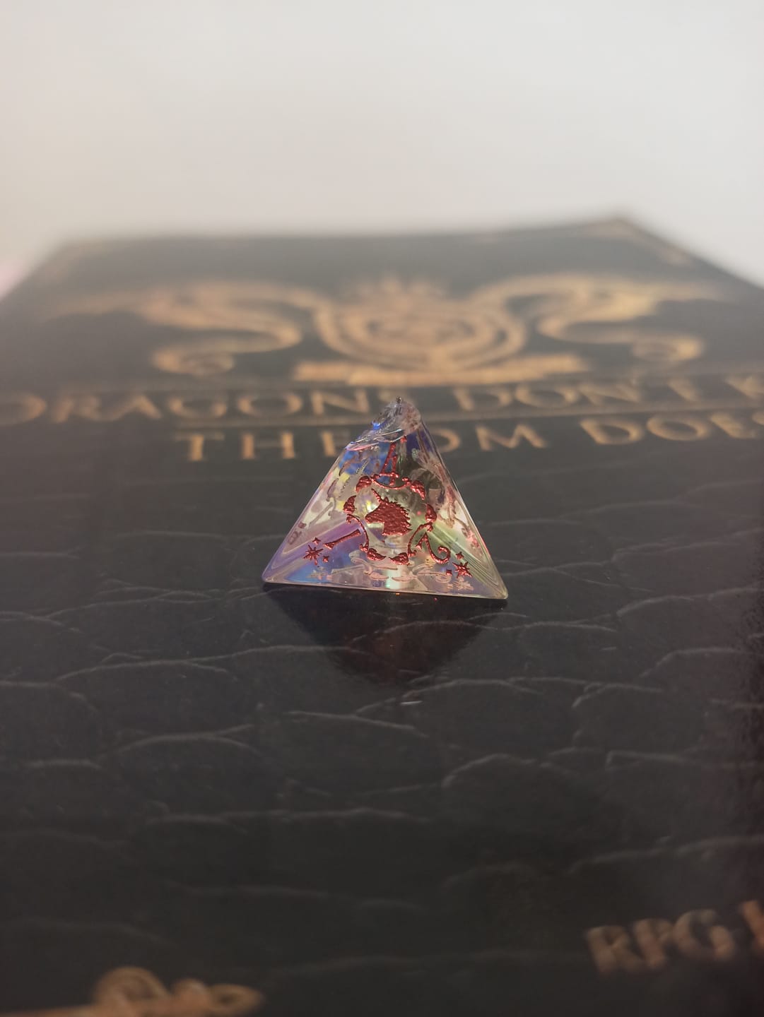 Customer photo review of URWizards D&D Dichroic Prism  Glass Engraved Dice Set Unicorn Style