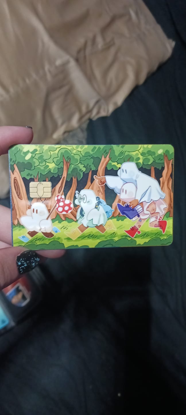 Customer photo review of Runaway Ghosts Credit Card Skins