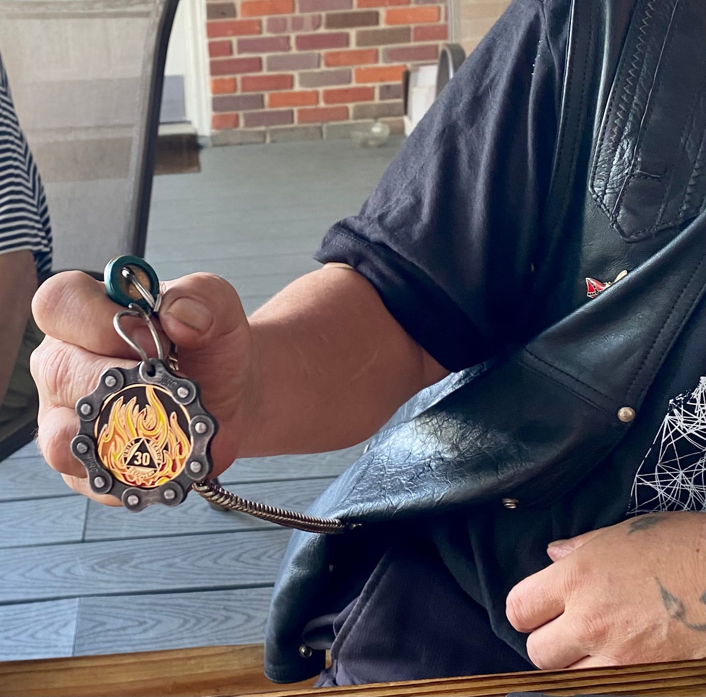 Customer photo review of 1 to 40 Year Sobriety Mint Twisted Flames Gold Plated AA Recovery Medallion/Chip/Coin - Black/Red/Orange/Yellow