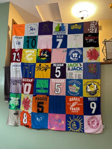 T-shirt quilt with track, music themes by Heather from MN