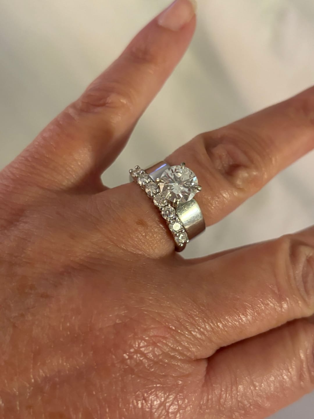 Customer photo review of Round Moissanite Sterling Silver Wedding Band Stackable Ring
