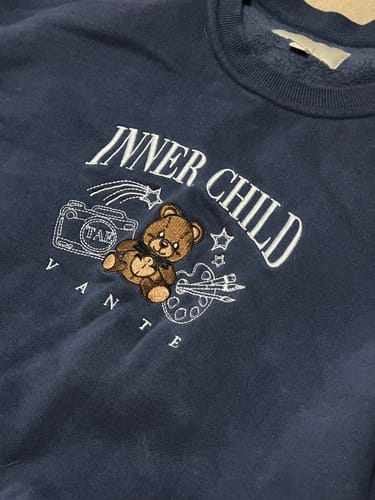 Customer photo review of Inner Child Crewneck Sweater