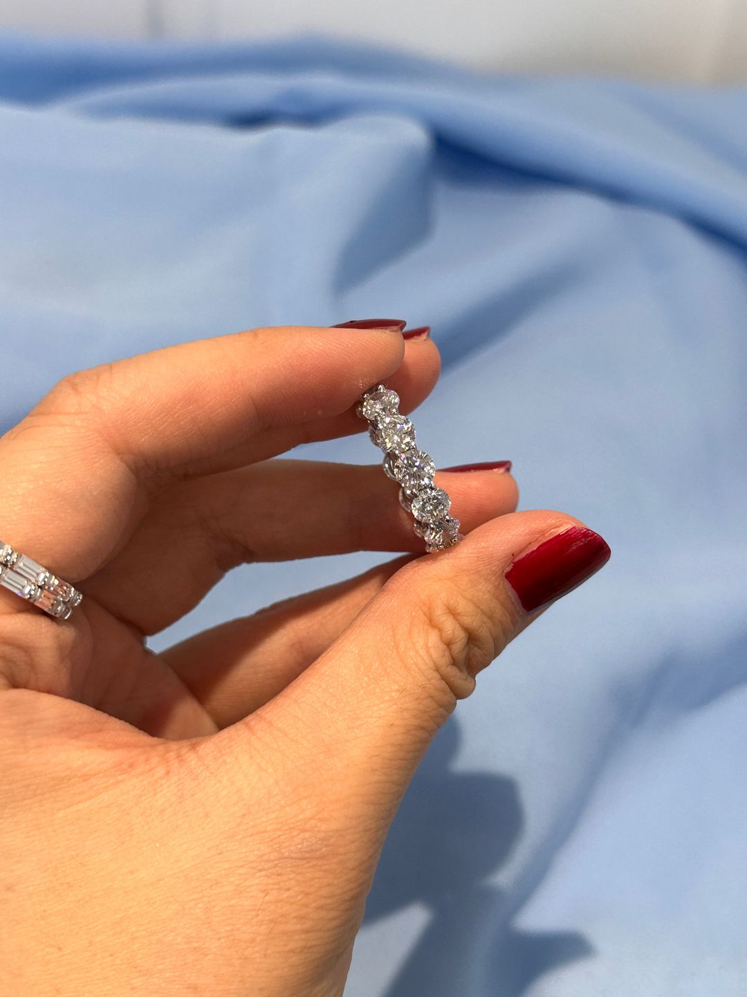 Customer photo review of Louily Classic Eternity Round Cut Women's Wedding Band In Sterling Silver