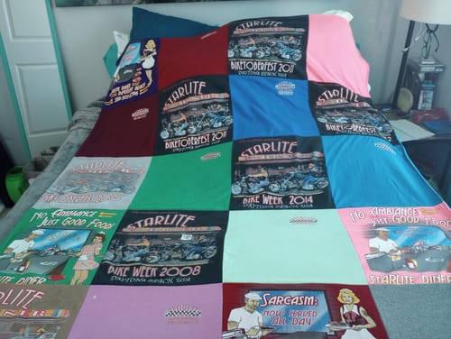 T-shirt quilt with dining, amusement themes by Marsha from FL