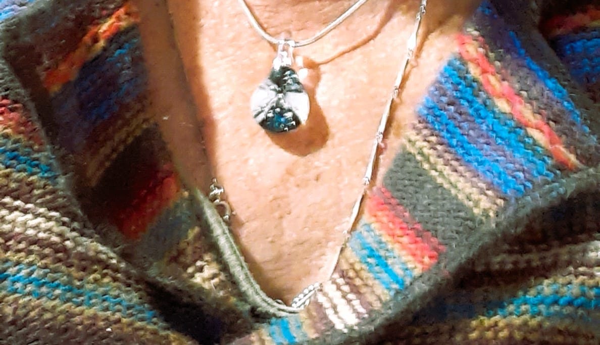 Customer photo review of Ocean Crash Pendant with Infused Cremation Ashes