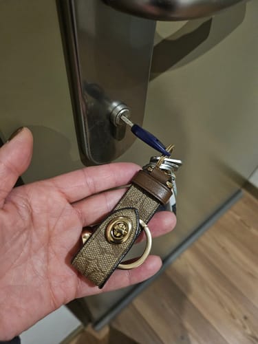 Customer photo review of Trigger Snap Bag Charm In Signature Canvas (Gold/Khaki)