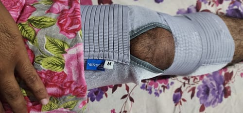 Customer photo review of Knee Wrap With Loop Elastic Technology | Provides optimum Compression & support to the Knee | Color - Grey (Single Piece)