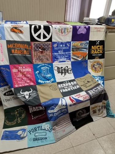 T-shirt quilt with travel, small towns themes by Diana from KS