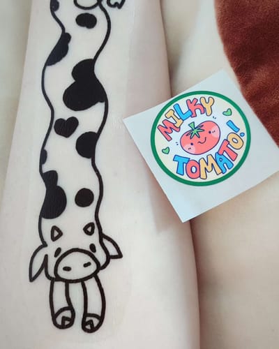 Customer photo review of Long Wiggly Cow Temporary Tattoo