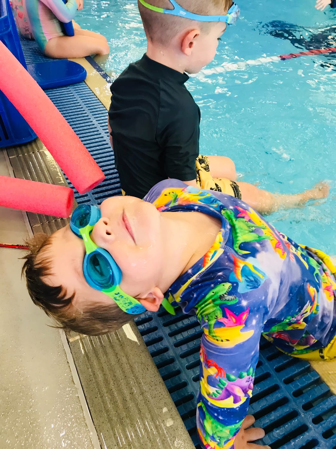 Customer photo review of Space Dinosaurs Kids' Rash Top
