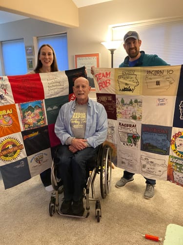 T-shirt quilt with cycling, charity themes by Ann from IA